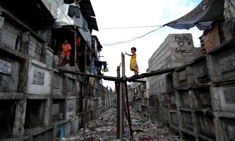 A child walks on a makeshift bridge betw