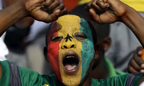 A Senegal fan encourages the side in their game against Ghana.