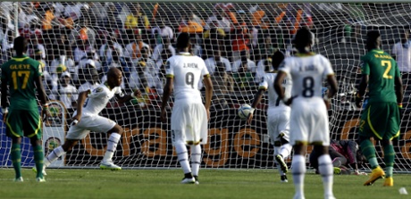 Ghana's Andre Ayew, second from left, celebrates after scoring the penalty.