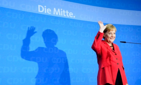 German Chancellor and leader of the Christian Democratic Union (CDU) Angela Merkel waves during the election evening after parliamentary elections at the CDU headquarters in Berlin on September 27, 2009.