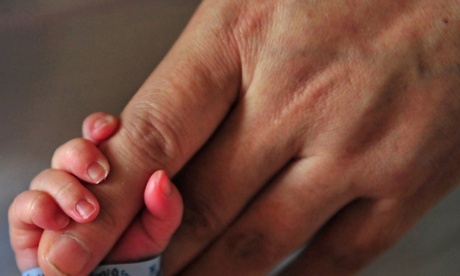 Katie Amos and Lee Johnston’s baby, Dax, reportedly born weighing 3lbs, is in the neonatal intensive care unit at Lenox Hill hospital in Manhattan.