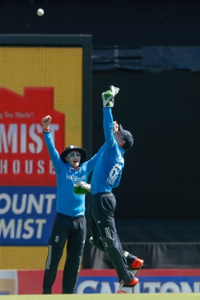 England wicketkeeper Jos Buttler celebrates taking the catch to dismiss Virat Kohli