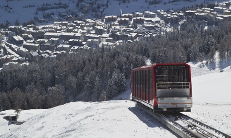 A cable train makes its way up the Weissfluhjoch mountain in Davos, Switzerland