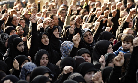 Mourners at the funeral of Hezbollah military leader Mohammed Issa, who was also killed in the Israe