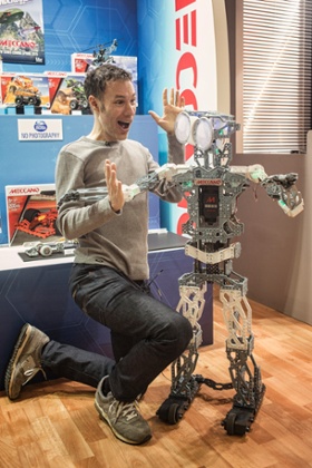 The 2015 Olympia Toy Fair. Vice president of Spin Master, Ben Varadi, shows off the Meccanoid robot.