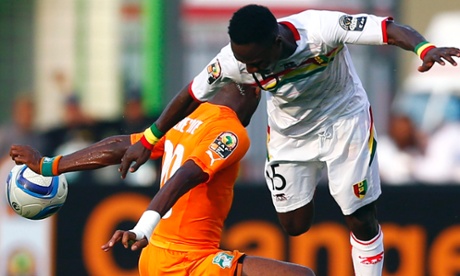 Serey Die of Ivory Coast is challenged by Guinea's Naby Keita.