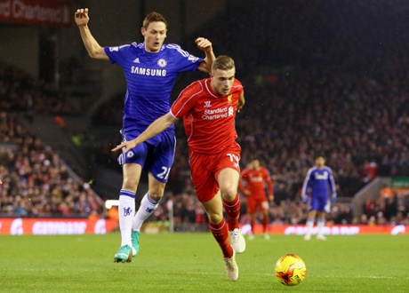 Jordan Henderson holds off Nemanja Matic.