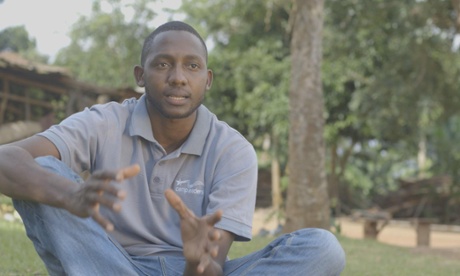 A man sitting and talking to the camera