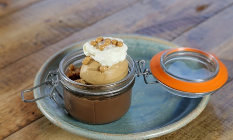 Chocolate pot: a glass jar of milk chocolate ganache with salted-caramel ice cream on top and aerated cream on top of that