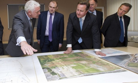 From left to right: Nigel Cann site director of Hinkley Point C, Ed Davey, David Cameron, Vincent de Rivaz, Chief Executive of EDF (Electricite de France) and Henri Proglio, CEO and Chairman of EDF, examine site plans for Hinkly C nuclear power station at Hinkley Point.