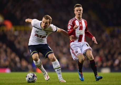 Harry Kane holds off Stefan Scougal.