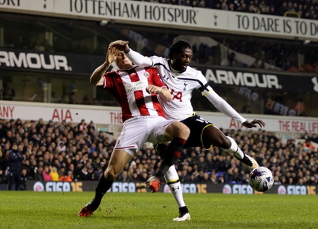 Emmanuel Adebayorgets a shot off.