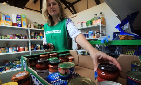 A Salisbury food bank volunteer sorts a donation of food.