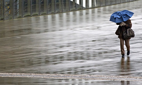 A woman walks past the European Commission HQ in Brussels