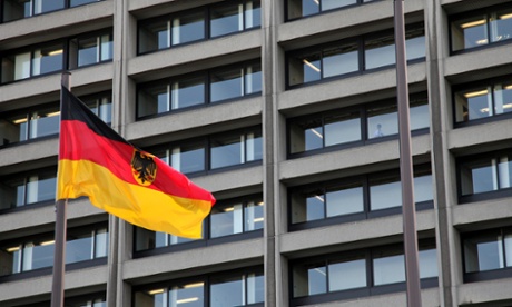 A German flag flies in front of the Bundesbank headquarters in Frankfurt.