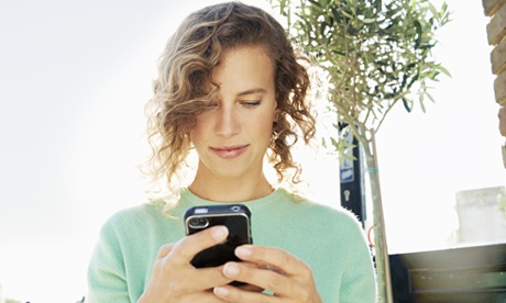 woman cell phone tree