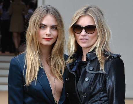 Cara Delevingne and Kate Moss attend the Burberry Prorsum show during London Fashion Week.