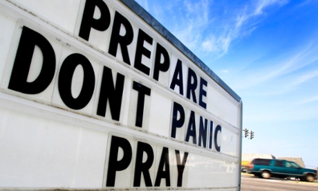 A sign reinforces concerns as locals prepare for a storm.