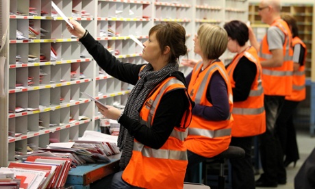 Royal Mail staff at the St. Rollox sorting office in Glasgow.