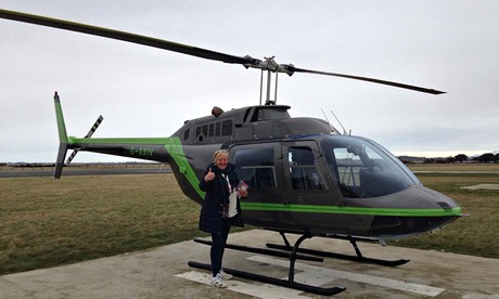 Janice Bannister next to the helicopter