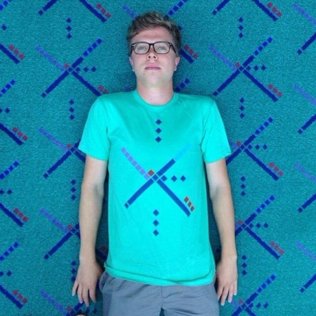 A Portland airport carpet devotee with matching T-shirt.