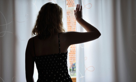 A woman looking through the window