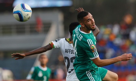 Ghana's Harrison Afful challenges Nabil Bentaleb of Algeria in a game of very few chances.