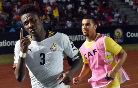 Asamoah Gyan celebrates the winner with team-mate Kwesi Appiah.