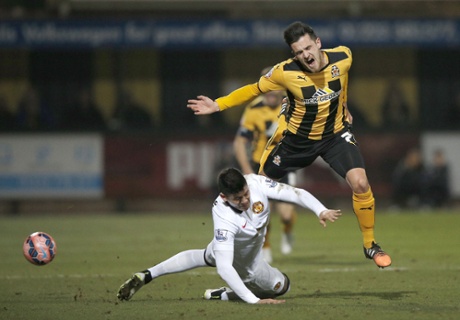 Manchester United defender Marcos Rojo takes out Ryan Donaldson with a solid tackle.