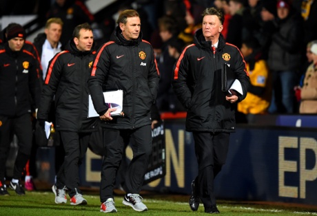 Van Gaal walks off the pitch at half-time. His plan doesn't seem to be working too well so far.