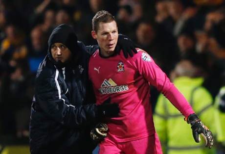 Manager Richard Money congratulates Chris Dunn at the end of the match.