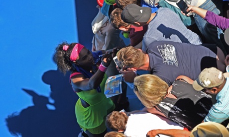 Serena Williams signs autographs after victory over Elina Svitolina on day six of the Australian Open in Melbourne.