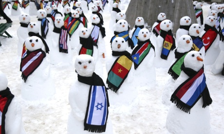 Snowmen decked out in various country flag scarfs, in Davos, Switzerland during the World Economic Forum.
