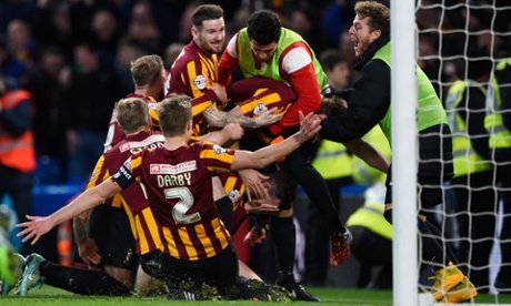 Andrew Halliday is under there somewhere as the Bradford City players pile on in celebration.