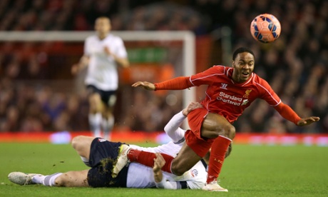 Bolton Wanderers' Matthew Mills hauls down Liverpool's Raheem Sterling and gets a yellow card for his troubles.  He was lucky it could easily have been red.