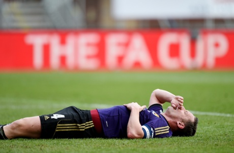 Kevin Nolan is knocked to the ground.