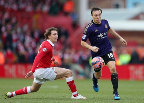 Mark Noble skips past City's Luke Freeman.