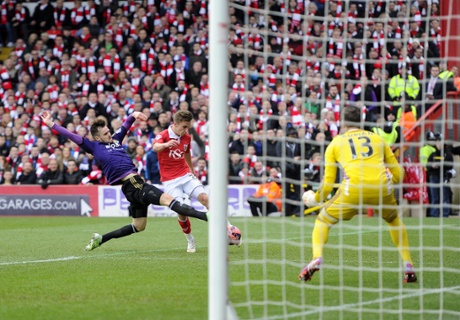 Joe Bryan’s shot fires narrowly wide.