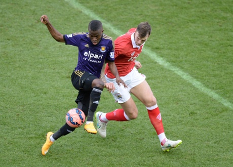 Enner Valencia battles for the ball with City's Aden Flint.