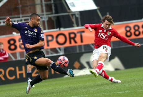 Luke Freeman has a shot, covered by Winston Reid.