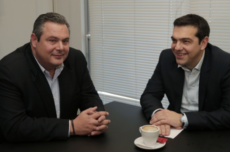 Alexis Tsipras, right, leader of Greece's left-wing main opposition Syriza party, and Panos Kammenos, chairman of the right-wing Independent Greeks party, smile during their meeting in Athens, Monday, Jan. 26, 2015.