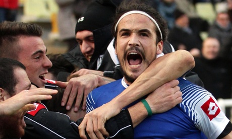 Cesena's Alejandro Rodriguez celebrates with his team-mates after scoring the winning goal.