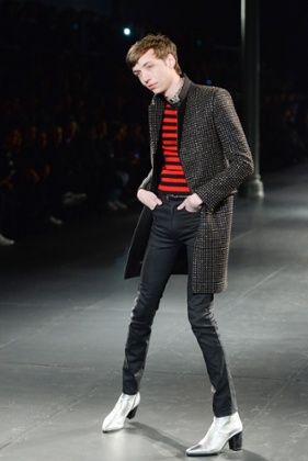 A model in heels on the Saint Laurent Menswear catwalk