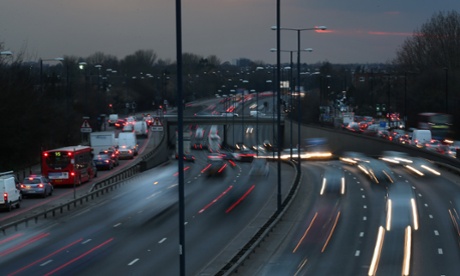 The sun sets as heavy traffic travels on the A40 dual carriageway on the eve of the Easter Bank Holiday weekend on March 28, 2013 in London, UK.