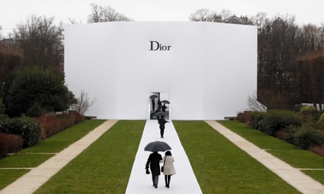 People arrive to attend Christian Dior 2015 haute couture spring-summer collection fashion show in Paris.