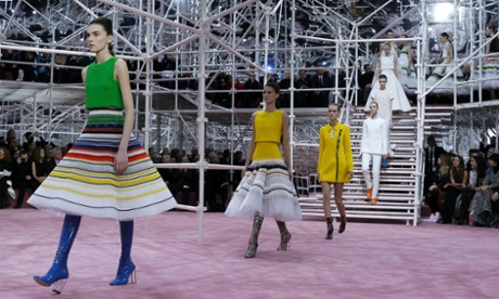Models present creations by Belgian designer Raf Simons as part of his haute couture spring summer 2015 fashion show.
