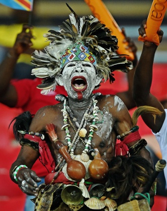 A fan cheers before the match between Democratic Republic of the Congo and Tunisia in Bata.