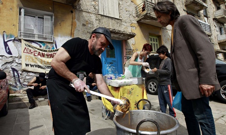 Man receiving food at a soup kitchen in Athens