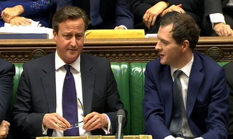 George Osborne (r) speaks to David Cameron during Prime Minister’s Questions in the House of Commons, London