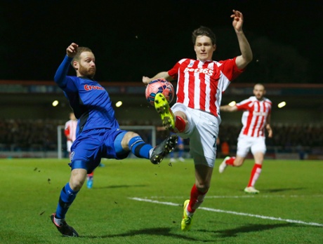 Rochdale's Matthew Done challenges Phillip Wollscheid.